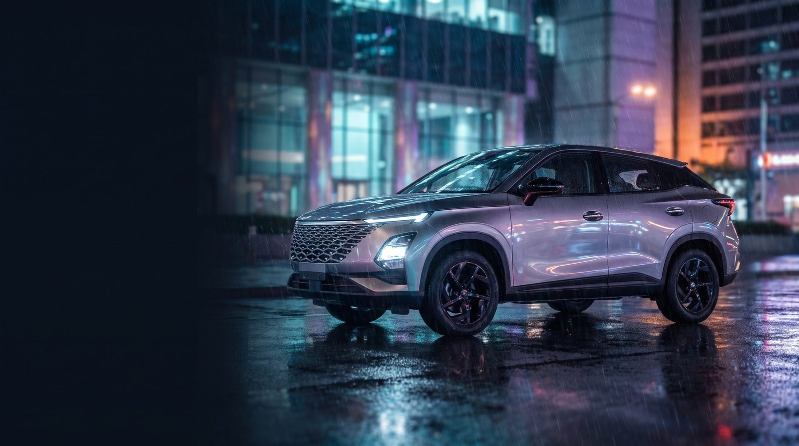 OMODA C5 on a rain-lit street in Victoria Island, Lagos at night
